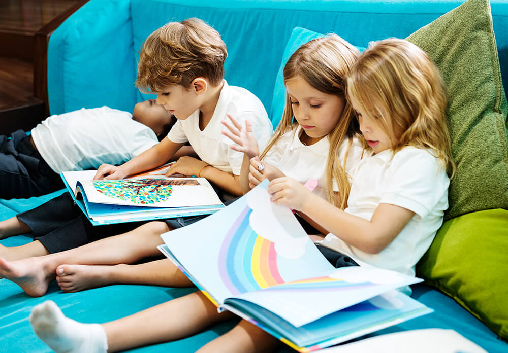 group-of-diverse-young-students-reading-children-s-PEXS9MS.jpg